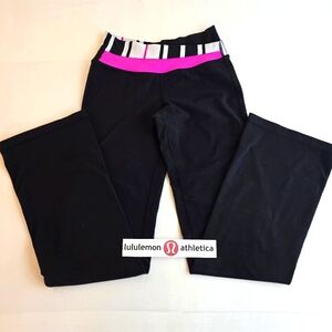 Lululemon Black Flared Leggings with Pink and White Criss Cross Waist!